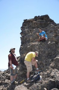 Team Utah students describing the lava in Ice Springs Volcanic Field. Photo source: http://woostergeologists.scotblogs.wooster.edu/2013/06/13/serious-geologizing-in-utah/
